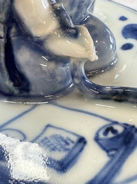 A rare Japanese blue and white 'Pipe Smoker' incense burner and cover, Edo, 17th C.