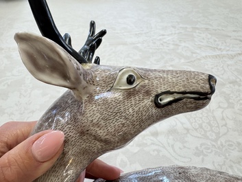 A pair of Chinese aubergine-glazed models of recumbent deer, 18/19th C.