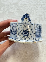 A blue and white Dutch Delft butter tub with a polychrome bird-shaped finial, 18th C.