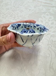 A Chinese Nanking water pot, a blue and white brush pot, a jarlet and a trick cup, Ming and later