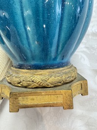 A pair of gilt-bronze-mounted Chinese turquoise-glazed vases, 19th C.
