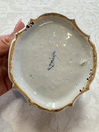 A blue and white Dutch Delft butter tub with a polychrome bird-shaped finial, 18th C.