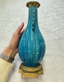 A pair of gilt-bronze-mounted Chinese turquoise-glazed vases, 19th C.