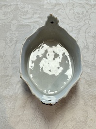 A blue and white Dutch Delft butter tub with a polychrome bird-shaped finial, 18th C.