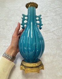 A pair of gilt-bronze-mounted Chinese turquoise-glazed vases, 19th C.