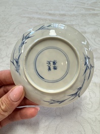 23 Chinese blue and white saucers with figural design, Yongzheng/Kangxi