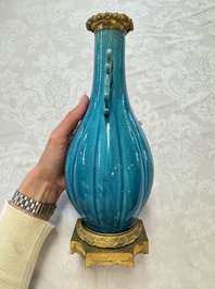 A pair of gilt-bronze-mounted Chinese turquoise-glazed vases, 19th C.