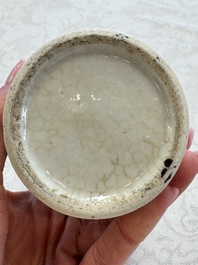 A Chinese Nanking water pot, a blue and white brush pot, a jarlet and a trick cup, Ming and later