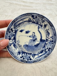 23 Chinese blue and white saucers with figural design, Yongzheng/Kangxi
