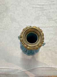 A pair of gilt-bronze-mounted Chinese turquoise-glazed vases, 19th C.