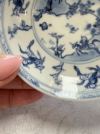 23 Chinese blue and white saucers with figural design, Yongzheng/Kangxi