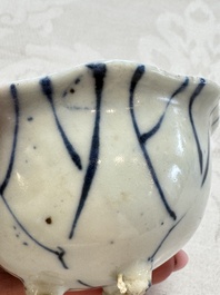 A Chinese Nanking water pot, a blue and white brush pot, a jarlet and a trick cup, Ming and later