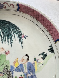 A Chinese famille rose 'Wine Drinking Sage and Attendant' dish, Yongzheng