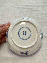 23 Chinese blue and white saucers with figural design, Yongzheng/Kangxi