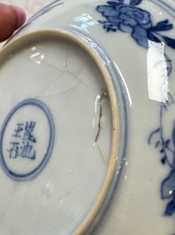 23 Chinese blue and white saucers with figural design, Yongzheng/Kangxi
