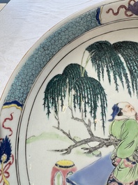 A Chinese famille rose 'Wine Drinking Sage and Attendant' dish, Yongzheng