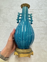 A pair of gilt-bronze-mounted Chinese turquoise-glazed vases, 19th C.