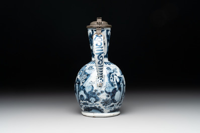 A blue and white Dutch Delft ewer with a mounted pewter lid, 17th C.
