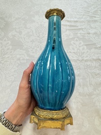 A pair of gilt-bronze-mounted Chinese turquoise-glazed vases, 19th C.