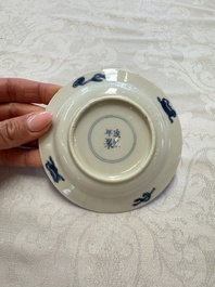 23 Chinese blue and white saucers with figural design, Yongzheng/Kangxi