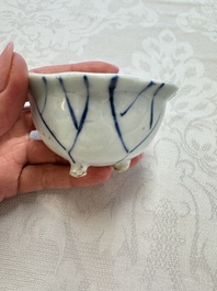 A Chinese Nanking water pot, a blue and white brush pot, a jarlet and a trick cup, Ming and later