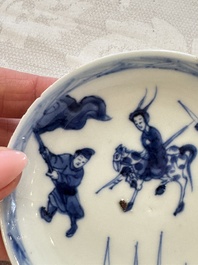 23 Chinese blue and white saucers with figural design, Yongzheng/Kangxi