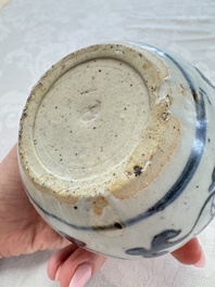 A Chinese Nanking water pot, a blue and white brush pot, a jarlet and a trick cup, Ming and later