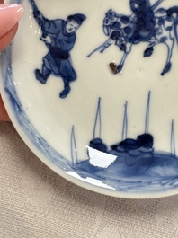 23 Chinese blue and white saucers with figural design, Yongzheng/Kangxi