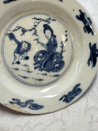 23 Chinese blue and white saucers with figural design, Yongzheng/Kangxi