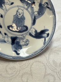 23 Chinese blue and white saucers with figural design, Yongzheng/Kangxi