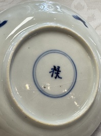 23 Chinese blue and white saucers with figural design, Yongzheng/Kangxi