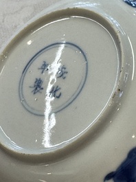 23 Chinese blue and white saucers with figural design, Yongzheng/Kangxi