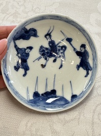 23 Chinese blue and white saucers with figural design, Yongzheng/Kangxi