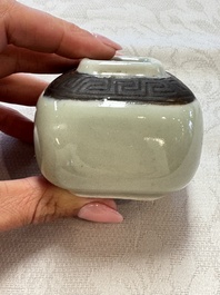 A Chinese Nanking water pot, a blue and white brush pot, a jarlet and a trick cup, Ming and later