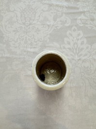 A Chinese Nanking water pot, a blue and white brush pot, a jarlet and a trick cup, Ming and later