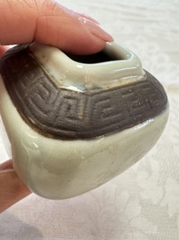 A Chinese Nanking water pot, a blue and white brush pot, a jarlet and a trick cup, Ming and later