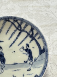 23 Chinese blue and white saucers with figural design, Yongzheng/Kangxi