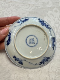 23 Chinese blue and white saucers with figural design, Yongzheng/Kangxi