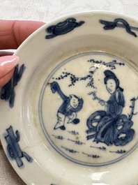 23 Chinese blue and white saucers with figural design, Yongzheng/Kangxi