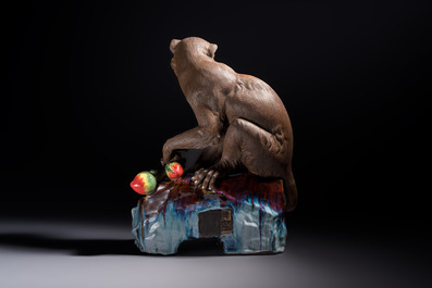 A Chinese polychrome-glazed Shiwan stoneware 'Monkey and Peach' group, signed, 20th C.