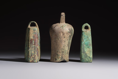 Seven various Chinese bronze and cast-iron bells, Han and later