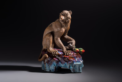 A Chinese polychrome-glazed Shiwan stoneware 'Monkey and Peach' group, signed, 20th C.