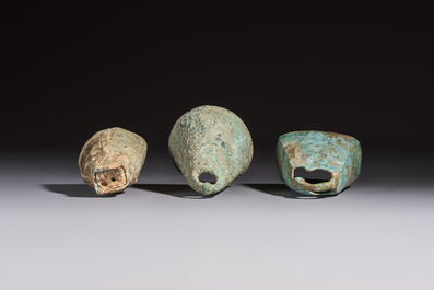 Seven various Chinese bronze and cast-iron bells, Han and later
