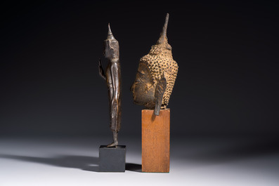 A bronze standing Buddha, a torso of Buddha and four heads of Buddha, Thailand, 17/18th C.