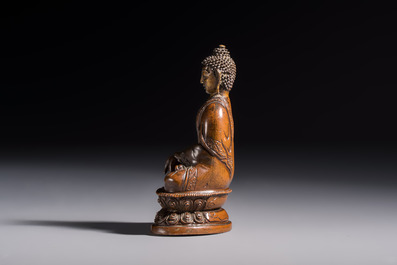 Three Tibetan bronze ritual bells and a bronze Buddha, 19th C.