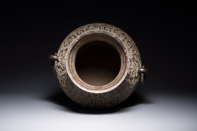A Chinese archaistic bronze vase with Taotie handles, 'Hu 壺', Ming