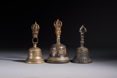 Three Tibetan bronze ritual bells and a bronze Buddha, 19th C.