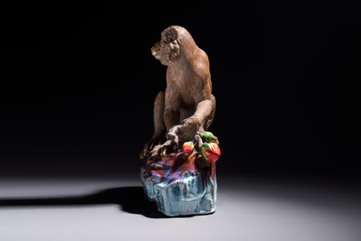A Chinese polychrome-glazed Shiwan stoneware 'Monkey and Peach' group, signed, 20th C.
