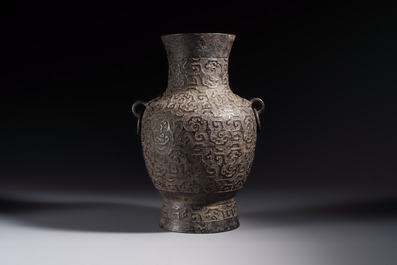 A Chinese archaistic bronze vase with Taotie handles, 'Hu 壺', Ming