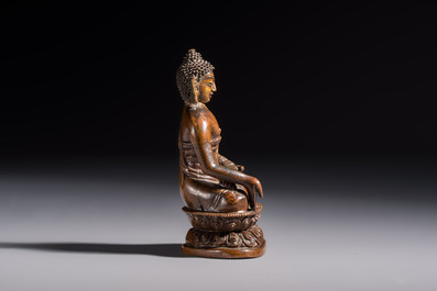 Three Tibetan bronze ritual bells and a bronze Buddha, 19th C.